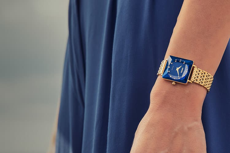 Swiss Womens Watches by Jowissa. Here you see the diamond inspired Facet Princess square watch with blue sunray dial and gold bracelet. All Swiss Made. Best Elegant blue Swiss Ladies Watch. 750x500px Mobile.