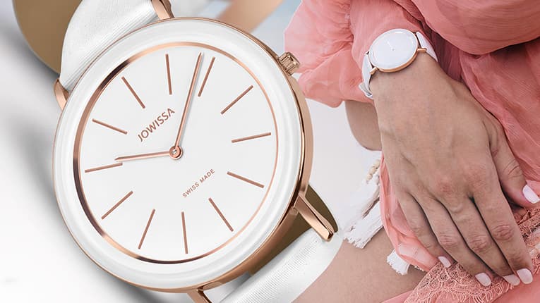 Alto Swiss Womens Watch by Jowissa. All Swiss Made minimalist design with white dial and white leather strap. The case is rose gold. Women wearing the Alto watch at the beach. Mobile image