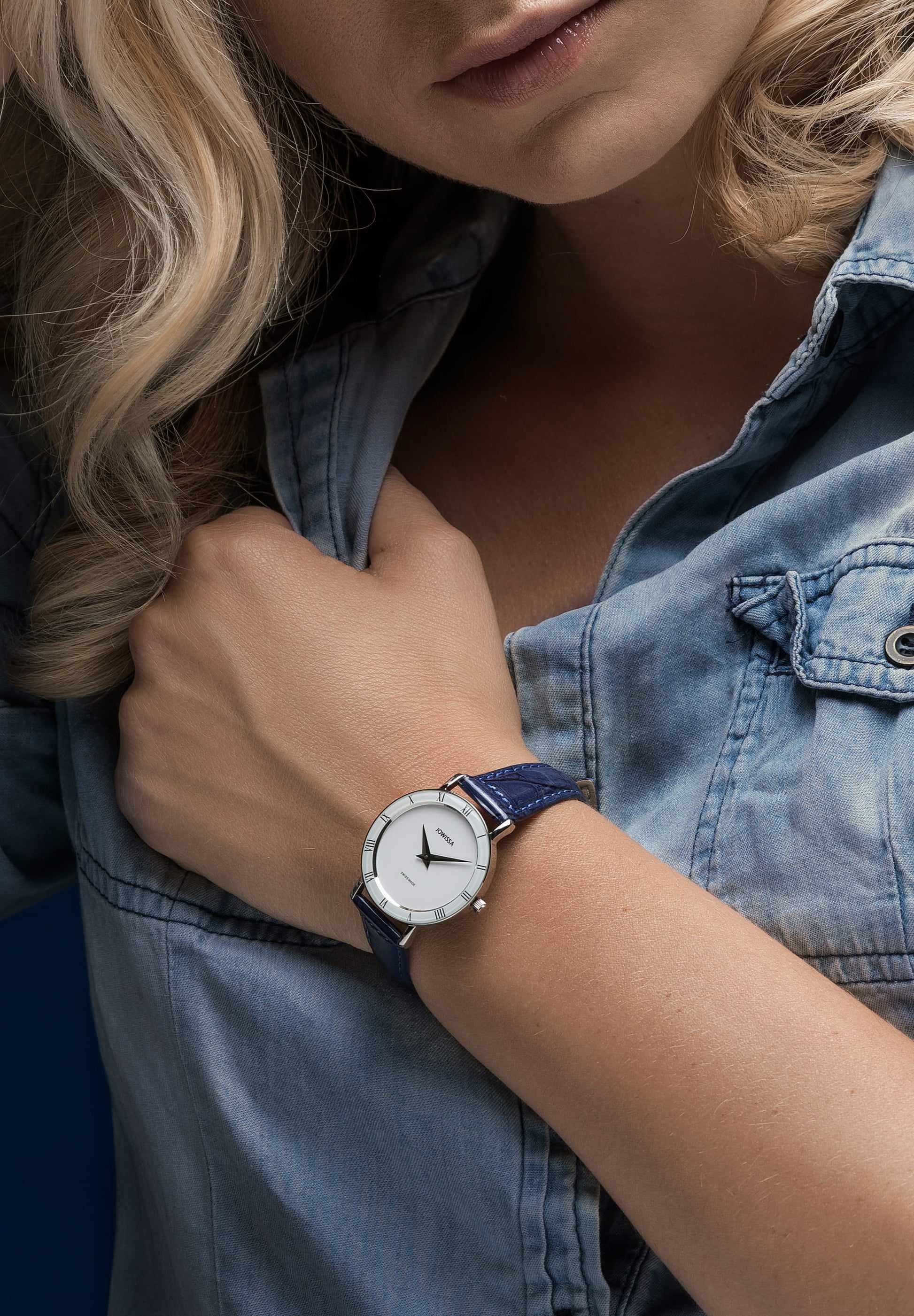 Blue swiss watch for ladies - with blue leather strap worn by a women - all swiss made