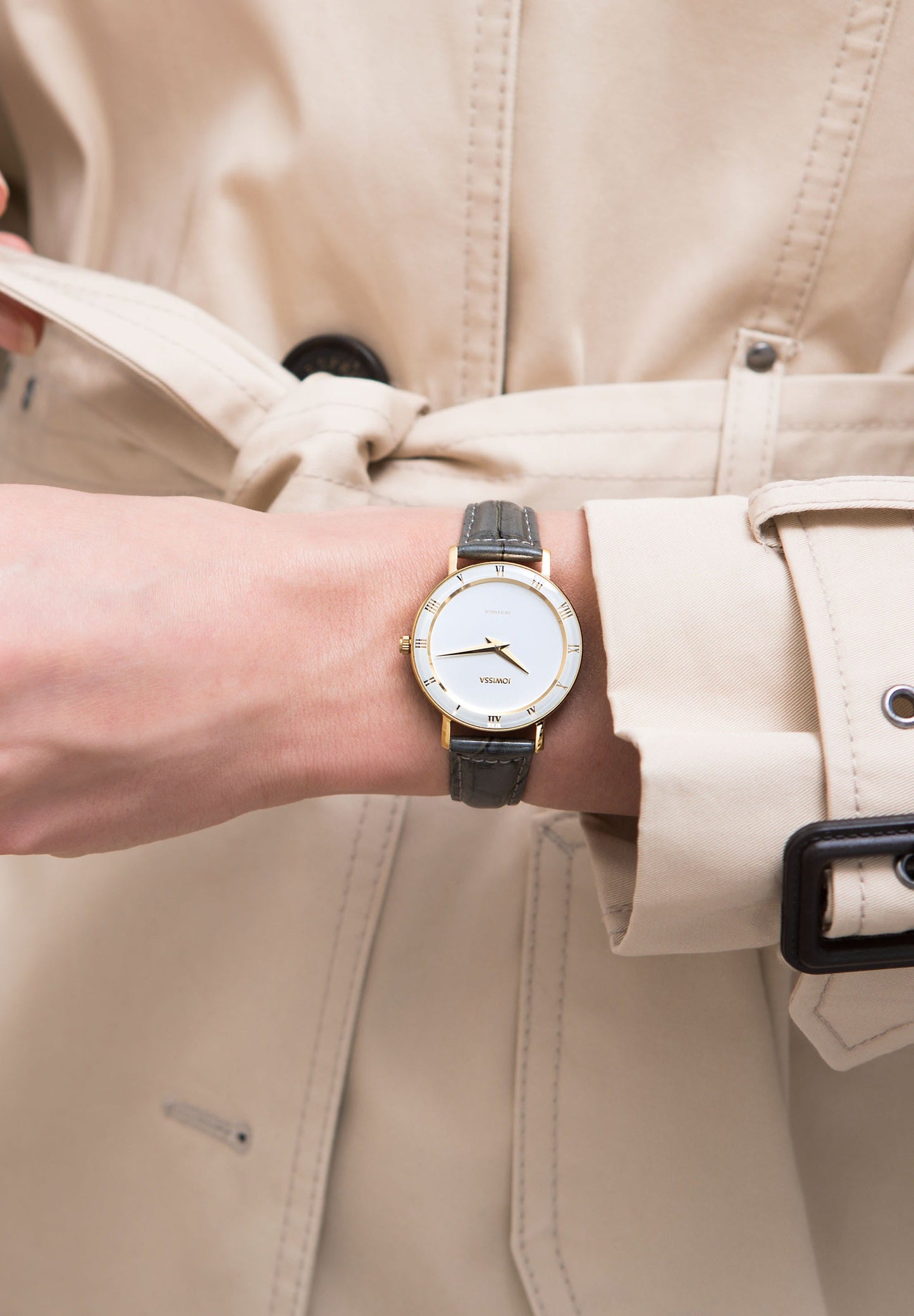 simple swiss made watch with white dial and leather watch band. 