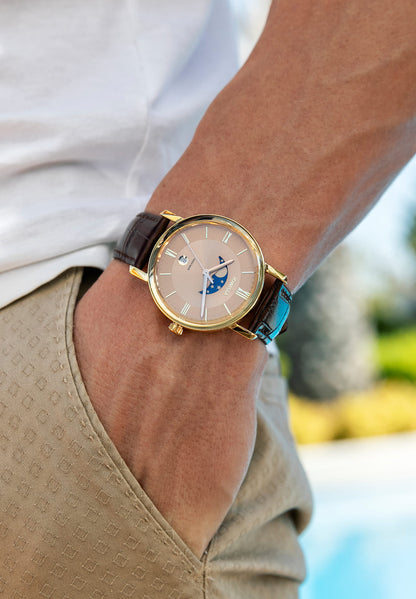 Brown swiss watch with gold dial that has the moon and the stars - has a brown leather strap - all swiss made