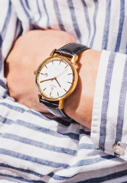 Gold swiss watch for men - with black leather strap white dial and gold details in the front - all swiss made watch