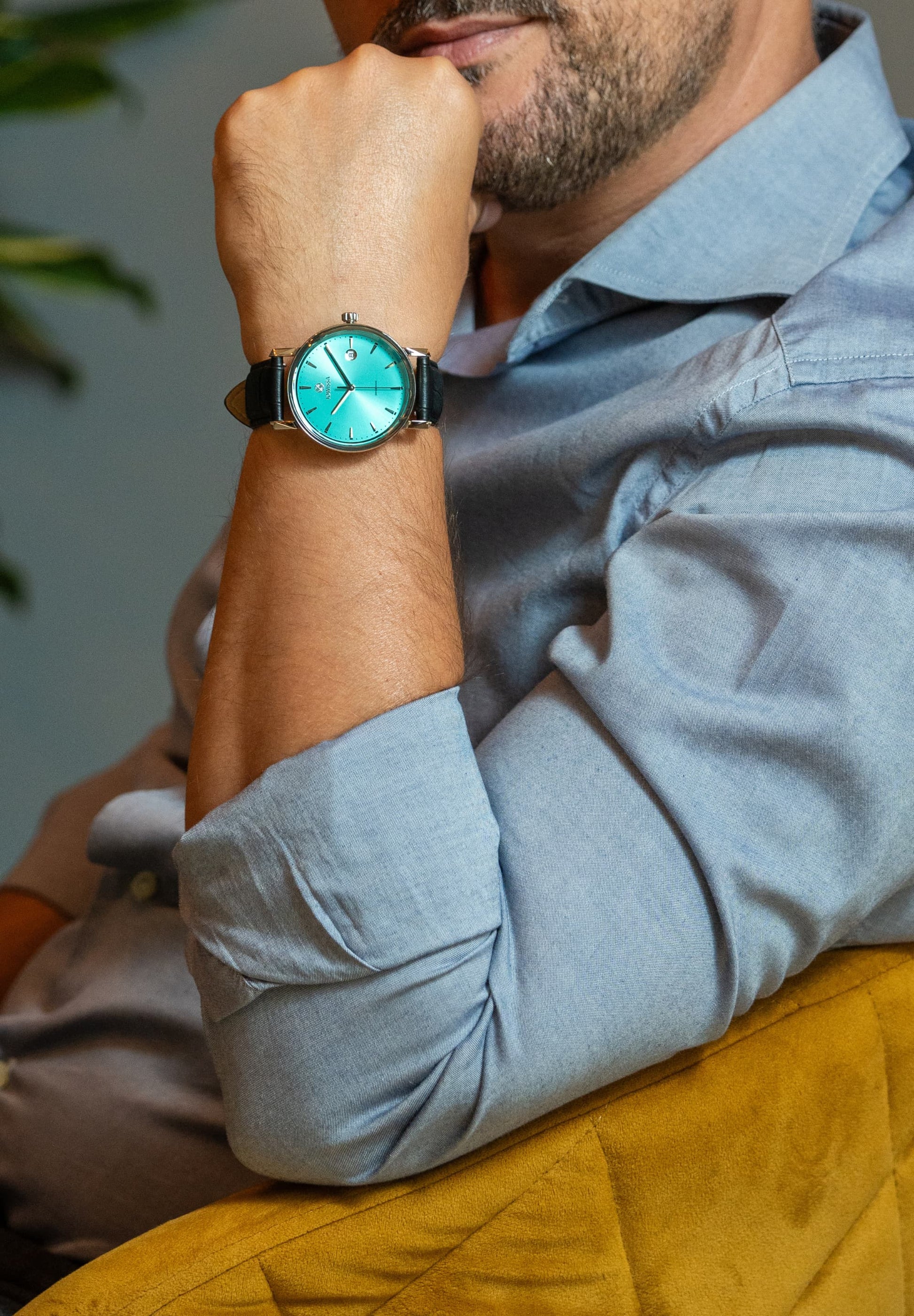 Jowissa Swiss Made Men Watch Magno, blue with a leather strap, worn by a light blue dressed gentlemen.