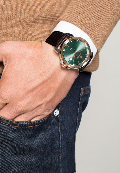 Swiss mens watch with green dial and brown leather strap with gold details in the front