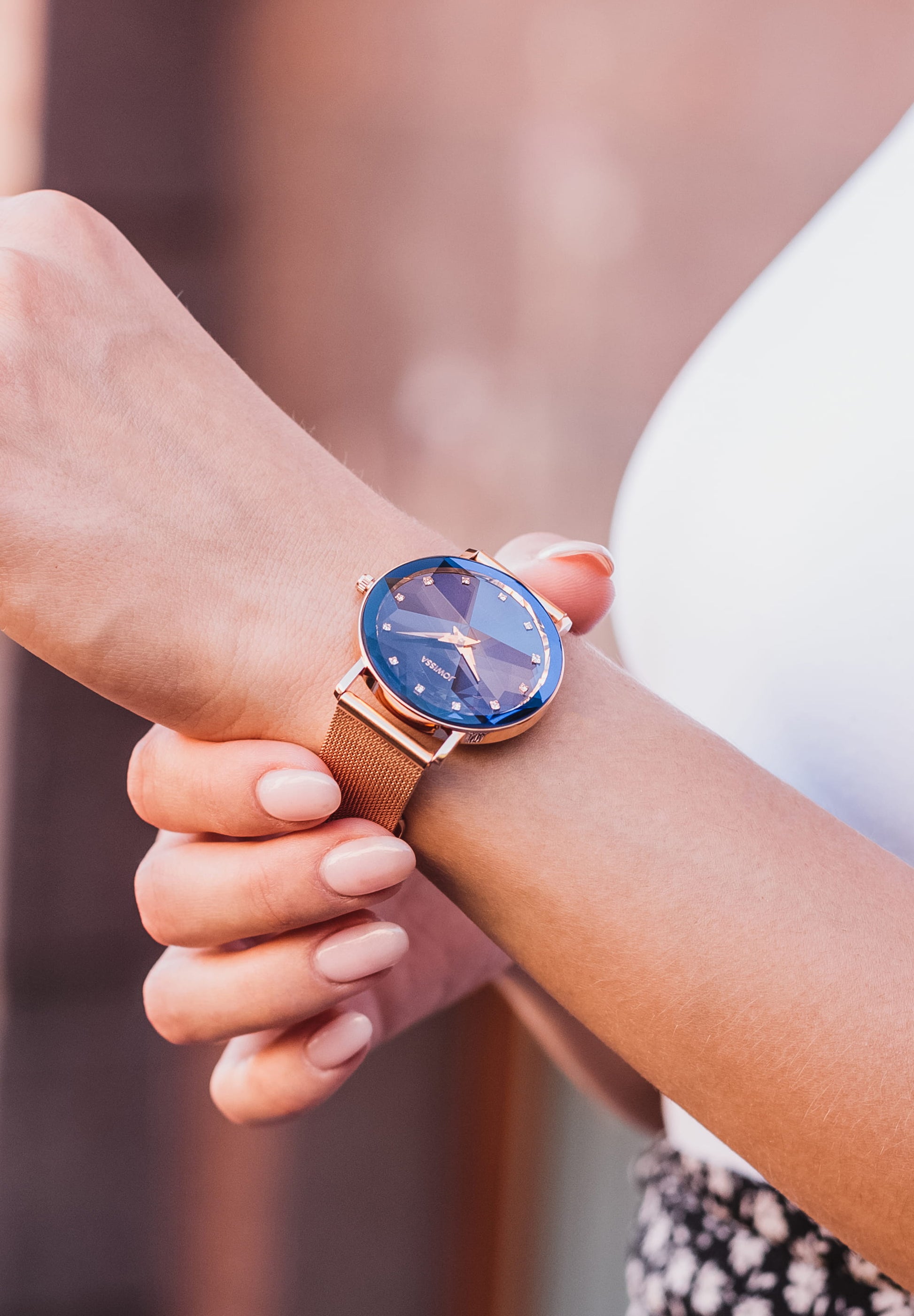 Swiss gold watch for ladies with blue dial and gold details in the front - watch is made for women in switzerland